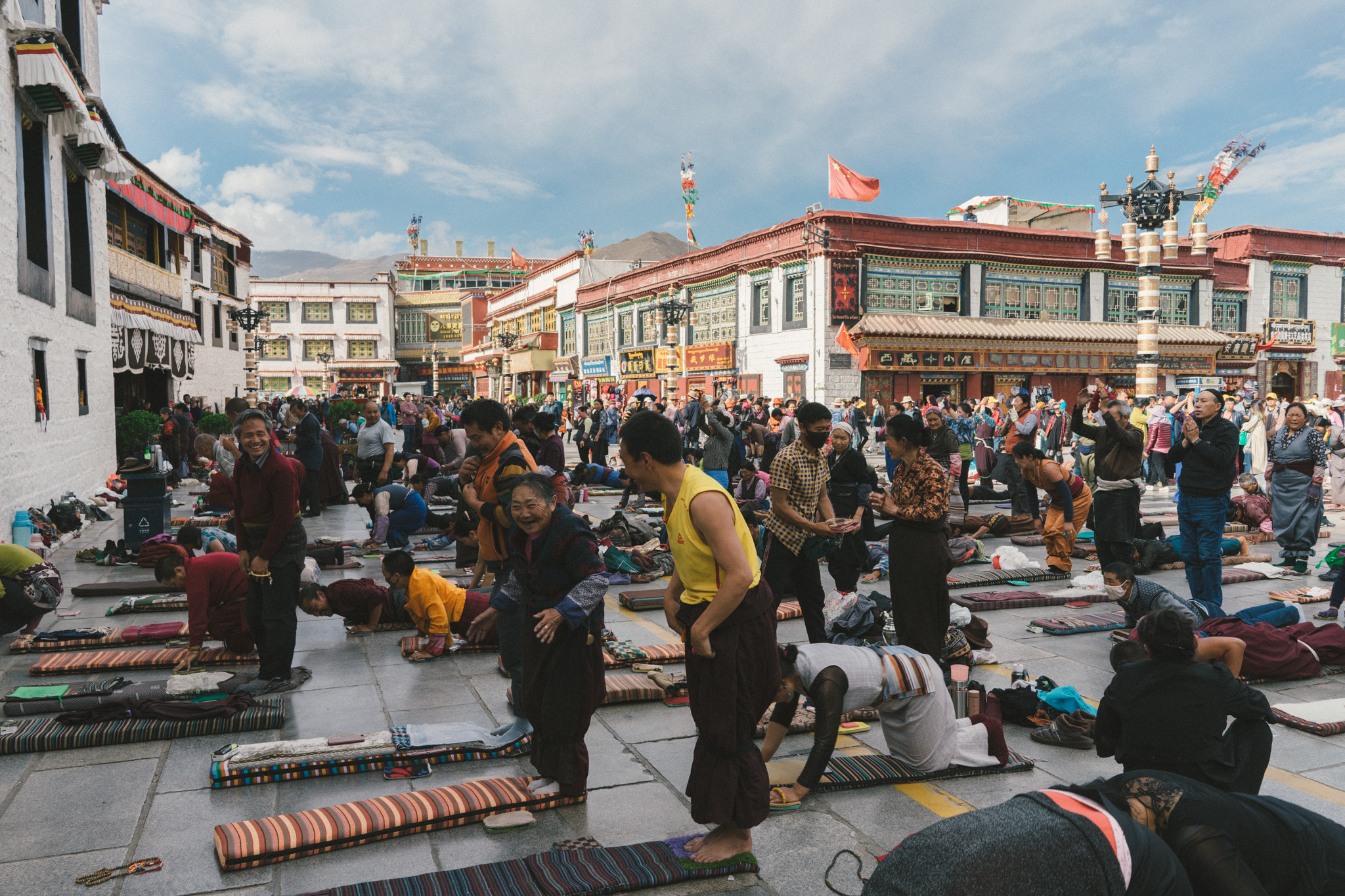 Tibetans prostrating in front of the Jokhang Monastery