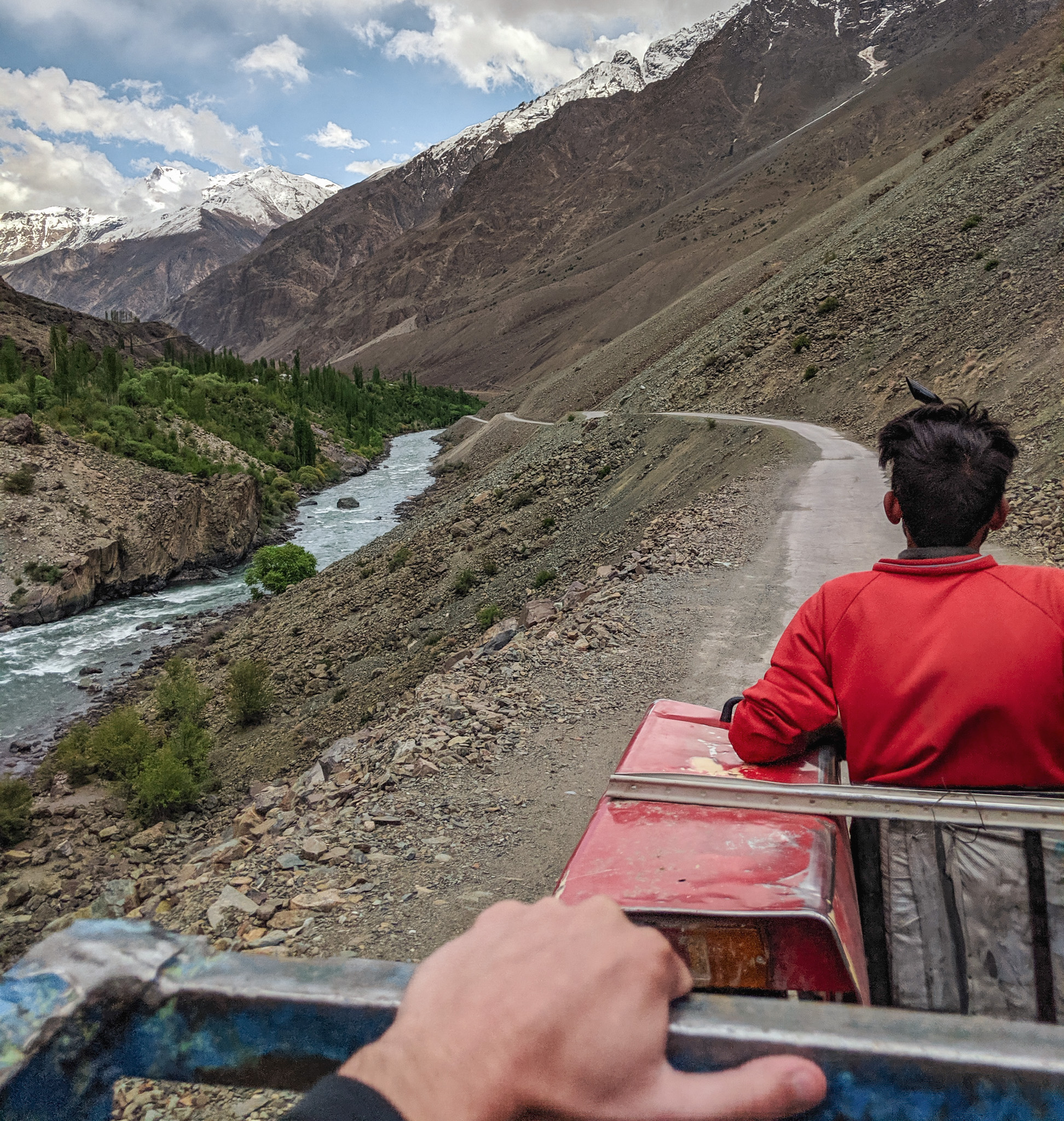 Hitchhiking in the back of a tractor