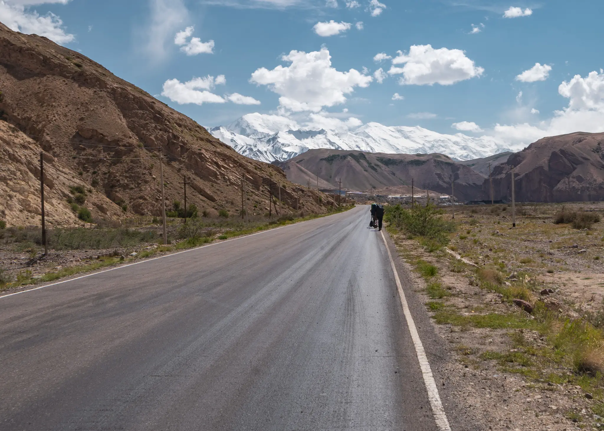 Walking across No Man's Land at the Irkeshtam Pass border crossing between China and Kyrgyzstan