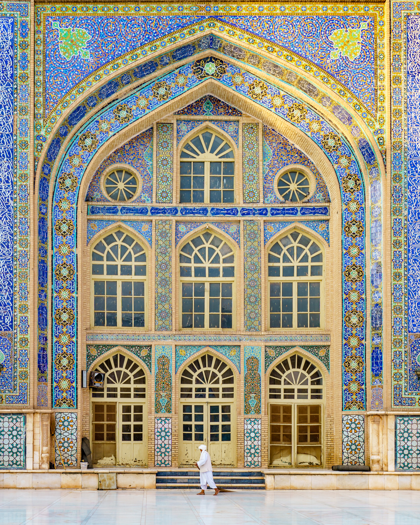 A cleaner walks inside the Great Mosque of Herat